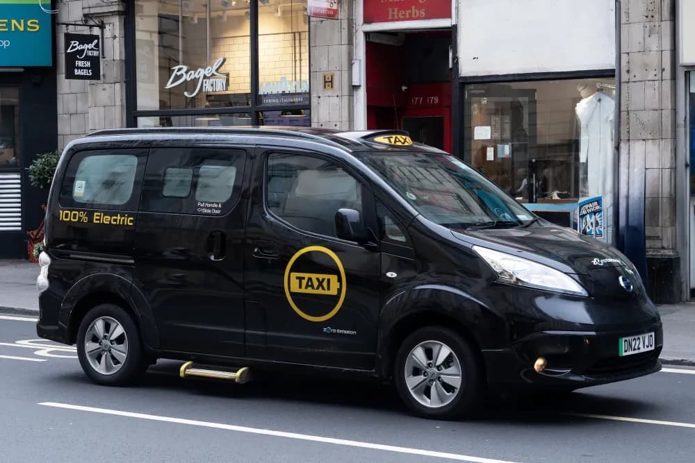 Use Electric or Eco-Friendly Taxis.webp